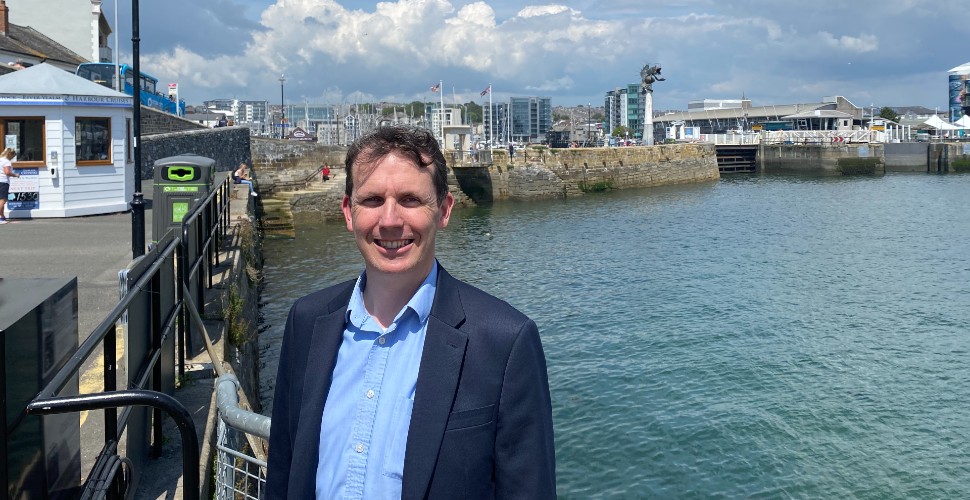 Glen Gardner stood in front of Mayflower Steps and the Barbican